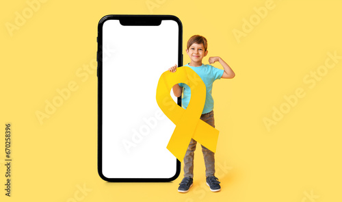 Little boy with golden ribb...