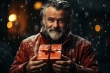 closeup of gift in Santa's hands, outdoor, evening street, festive lights, Christmas or New Year holidays