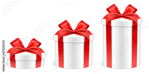 Different height round shape white gift boxes wrapped with red ribbons, isolated on background. Tall, low and normal size realistic cylindrical giftbox set, vector illustration.