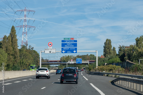 Fototapeta Naklejka Na Ścianę i Meble -  Highway road signs Paris, driving in heavy traffic on ring road of capital of France, traffic jam problems in Paris