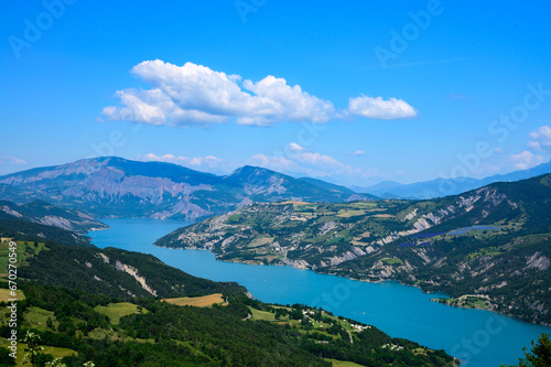 Aerial view on blue Lake of Serre-Poncon, reservoir border between Hautes-Alpes and Alpes-de-Haute Provence  departments, one of largest in Western Europe