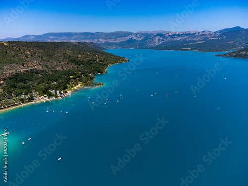Aerial view on blue Lake of Serre-Poncon, reservoir border between Hautes-Alpes and Alpes-de-Haute Provence   departments, one of largest in Western Europe © barmalini