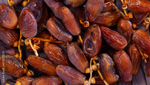 Closeup of ripe dried dates on branches. Natural food background