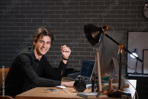 Happy young male programmer...