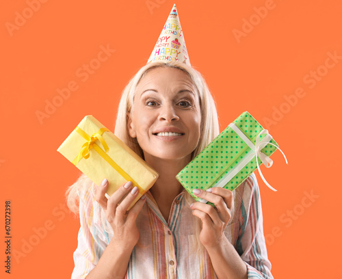 Happy mature woman in party...