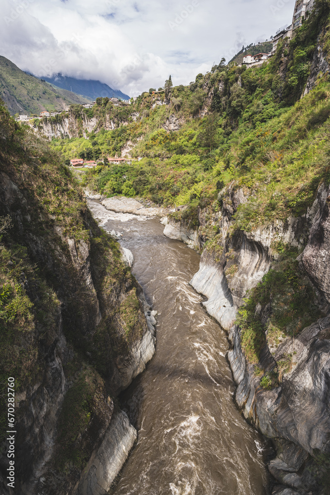 Magnificent view of the river and mountains in a deep canyon in the city of Banos, Ecuador. Magnificent view of the river and mountains in a deep canyon in the city of Banos, Ecuador.