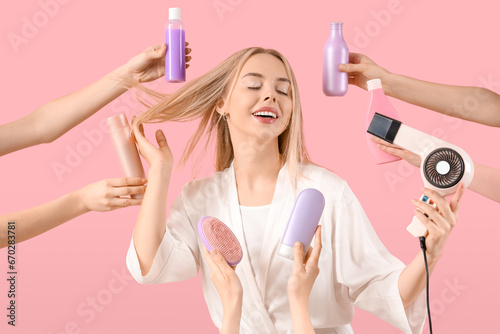 Young blonde woman drying h...