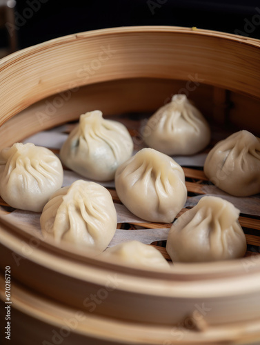 Chinese steamed dumplings in a bamboo steamer. Traditional asian food appetizer closeup