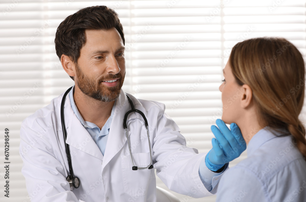 Doctor in medical gloves examining woman`s oral cavity indoors Doctor in medical gloves examining woman`s oral cavity indoors
