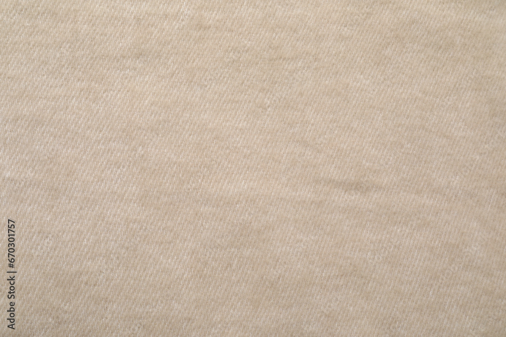 Fototapeta premium Texture of beige blanket as background, top view