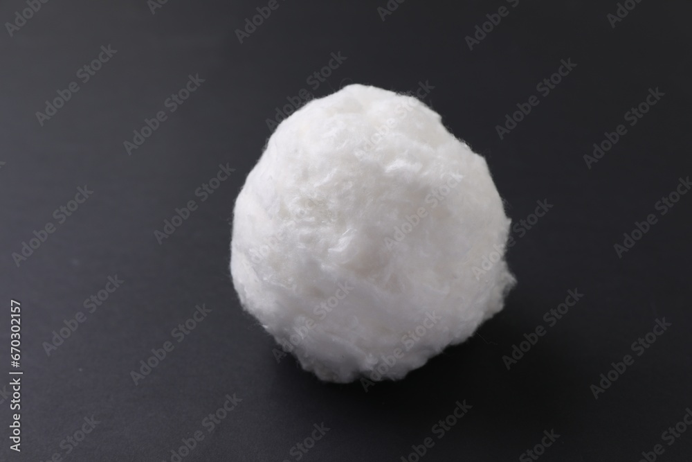 Ball of clean cotton wool on grey background, closeup