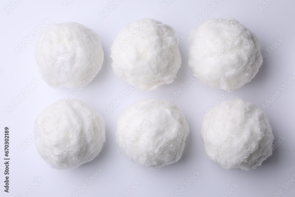 Balls of clean cotton wool on white background, top view