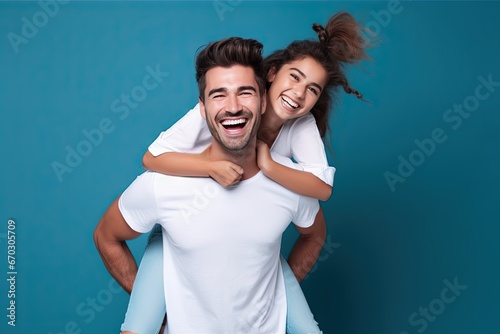 background blue isolated jeans denim tshirt white wearing piggyback laughing people cheerful Portrait beautiful dream care carefree children childhood content father daughter day embracing