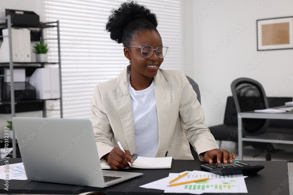 Professional accountant working at desk in office