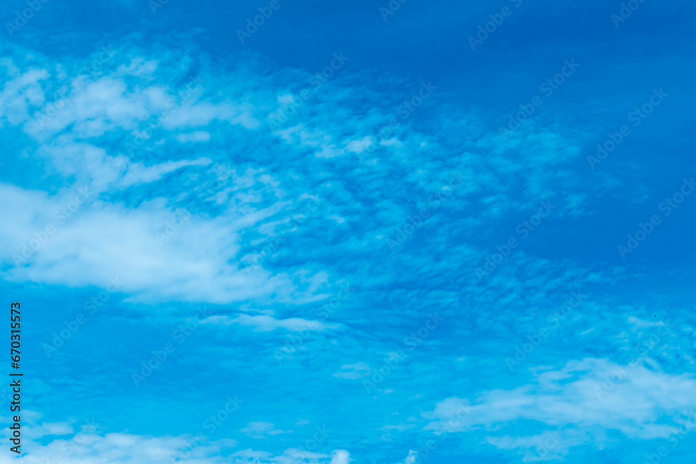 Capture the daytime sky with clouds and natural sunlight