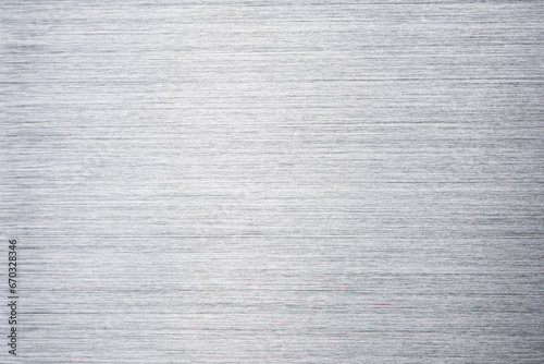 Brushed metal stainless steel texture background with reflection light