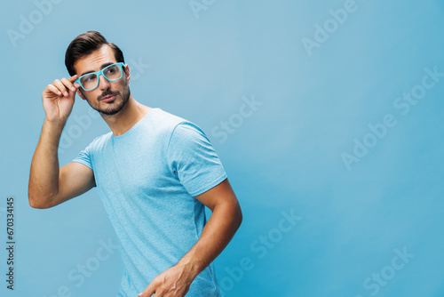 Beard man portrait lifestyle t-shirt style fashion blue background smile trendy glasses modern attractive smart