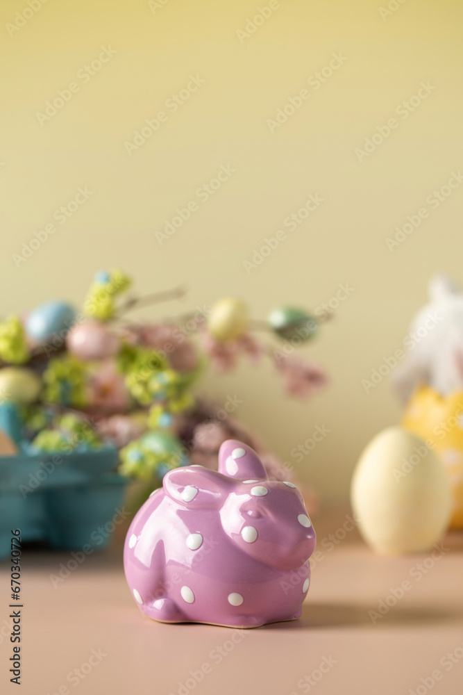 Lilac rabbit on a yellow Easter background. The concept of Easter. Lilac rabbit on a yellow Easter background. The concept of Easter.