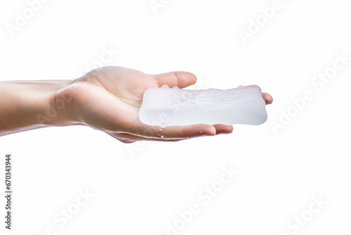 Man hand tossing a floating soap on white background photo