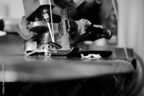 Vintage Black and White Close up Serger or Overlock Machine with threads, vintage black and white concept