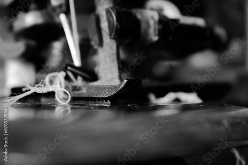 Vintage Black and White Close up Serger or Overlock Machine with threads, vintage black and white concept