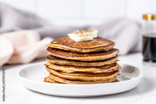 keto friendly pancakes stacked on a white plate