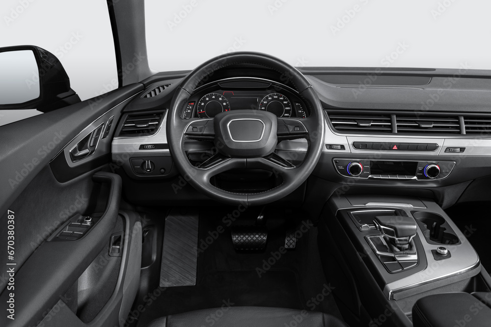 New car Interior - steering wheel, shift lever and dashboard, climate control, speedometer, display on white background