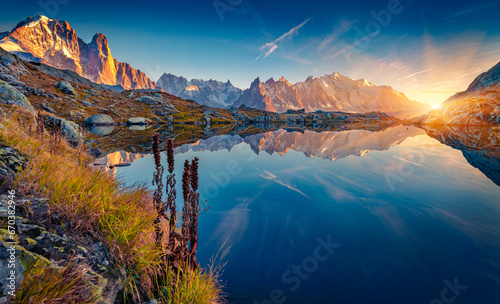 Fototapeta Naklejka Na Ścianę i Meble -  Superb autumn sunrise on Cheserys lake with Mount Blank on background. Spectacular outdoor scene of Vallon de Berard Nature Preserve, Chamonix location, Alps, France, Europe.