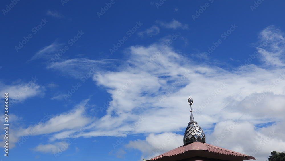 Islamic mosque and blue sky, perspective of mosque dome and lower angle view. Islamic mosque and blue sky, perspective of mosque dome and lower angle view.