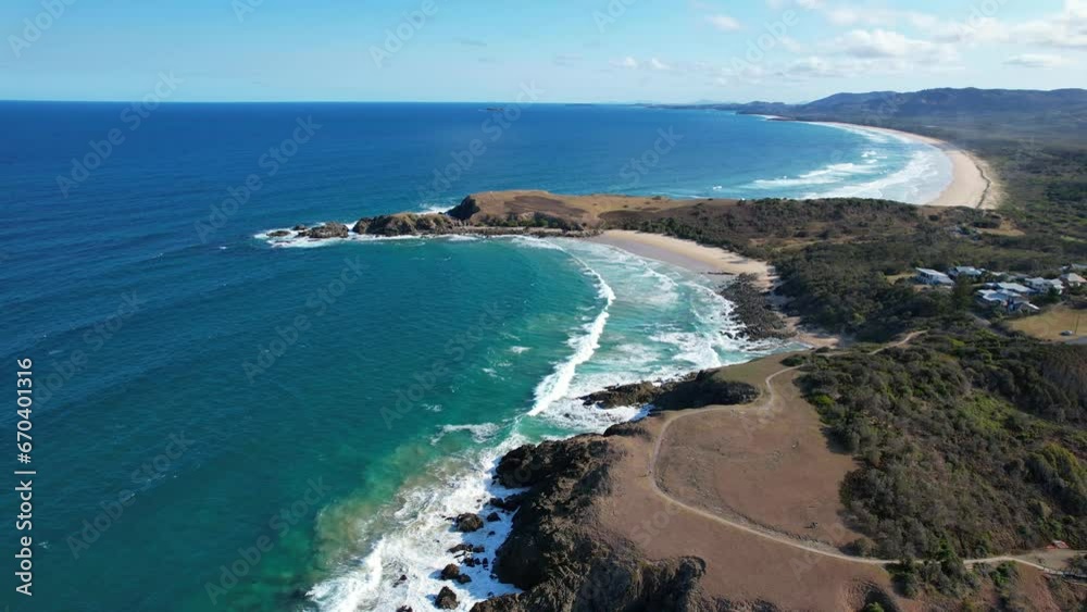 A View Of Shelly Beach And Emerald Beach Headland In New South Wales, Australia. Aerial Pullback Shot A View Of Shelly Beach And Emerald Beach Headland In New South Wales, Australia. Aerial Pullback Shot