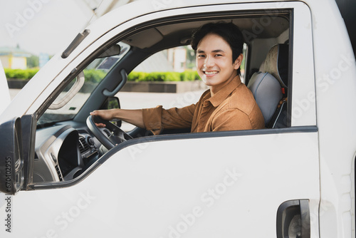 Photo of young Asian man with his truck