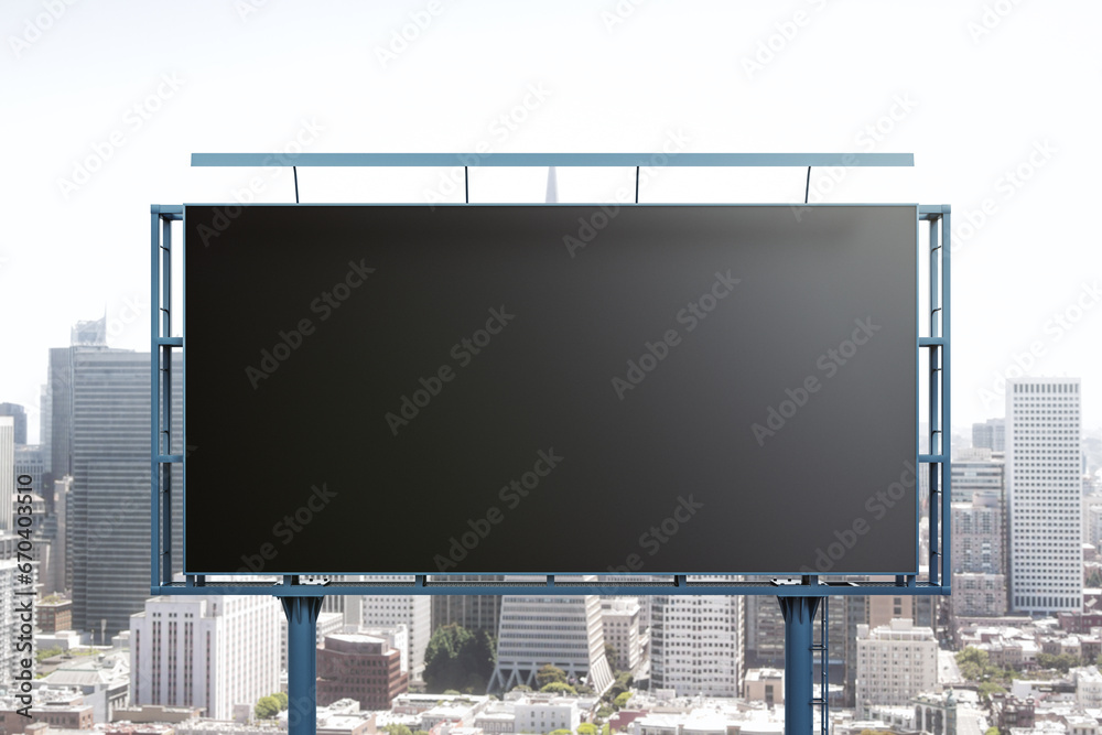 Blank black billboard on cityscape background, front view. Mock up, advertising concept Blank black billboard on cityscape background, front view. Mock up, advertising concept