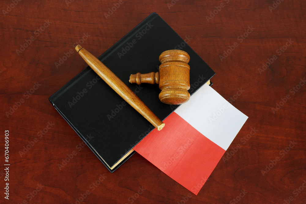 Broken judge gavel and legal book with flag of Poland. Polish legal system problems concept.