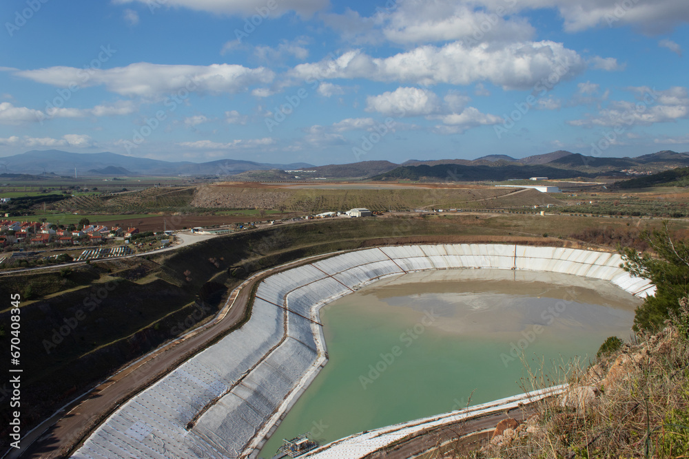 Liquid waste landfill surrounded by mountains