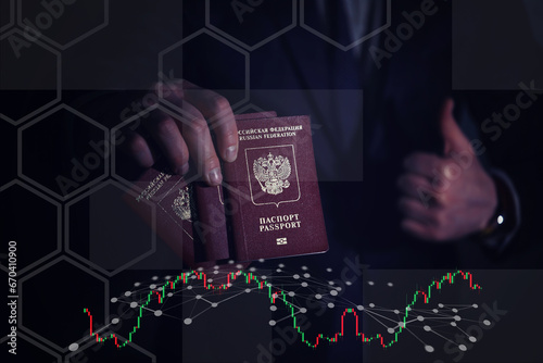 men's hands hold a red foreign Russian passport against the background of themselves in a suit, their faces are not visible. close-up photo