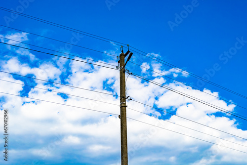 Power electric pole with line wire on colored background close up photo