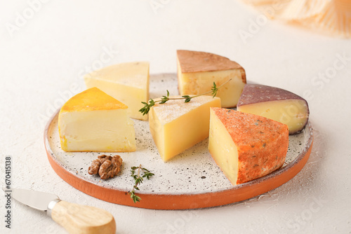 a plate of assorted cheese of different colors, close-up