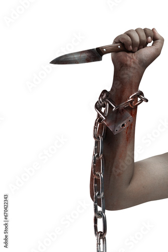The hand of a scary zombie with blood and wounds holding a knife while tied to the iron chain © Leo Lintang