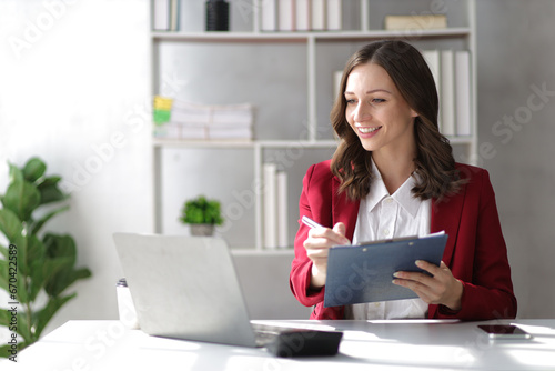 Attractive businesswoman working in the office.