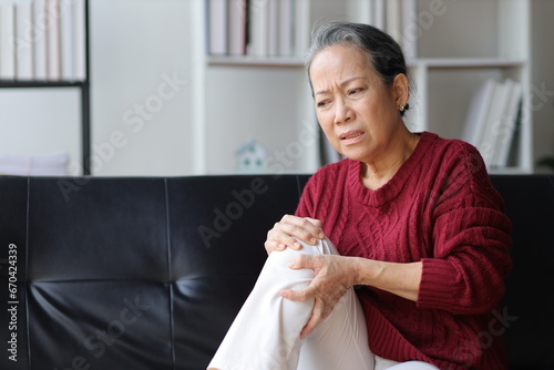 Senior woman with osteoarthritis has leg pain.