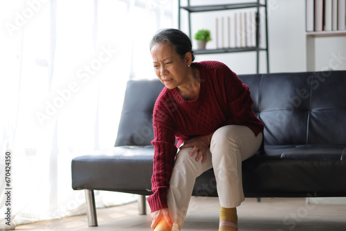 Senior woman with osteoarthritis has leg pain.