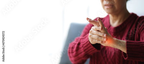 Senior woman with arm pain and wrist pain.