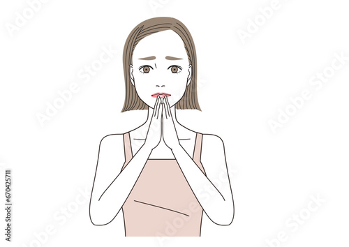手をあわせて苦悩している表情の女性