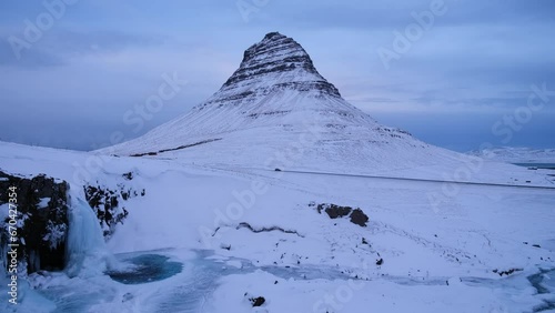 Kirkjufell mountain, Iceland. Winter landscape. Snow and ice. A popular place to travel in Iceland.