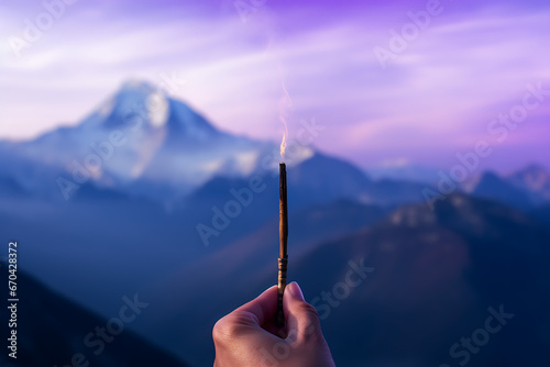 Hand holding a incense stick, smoke, himalaya incense, smell, prayer