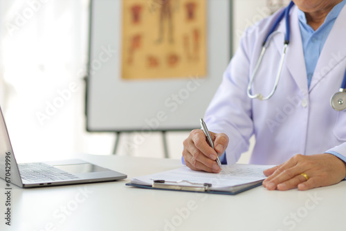 Doctor working in the medical office at the hospital.