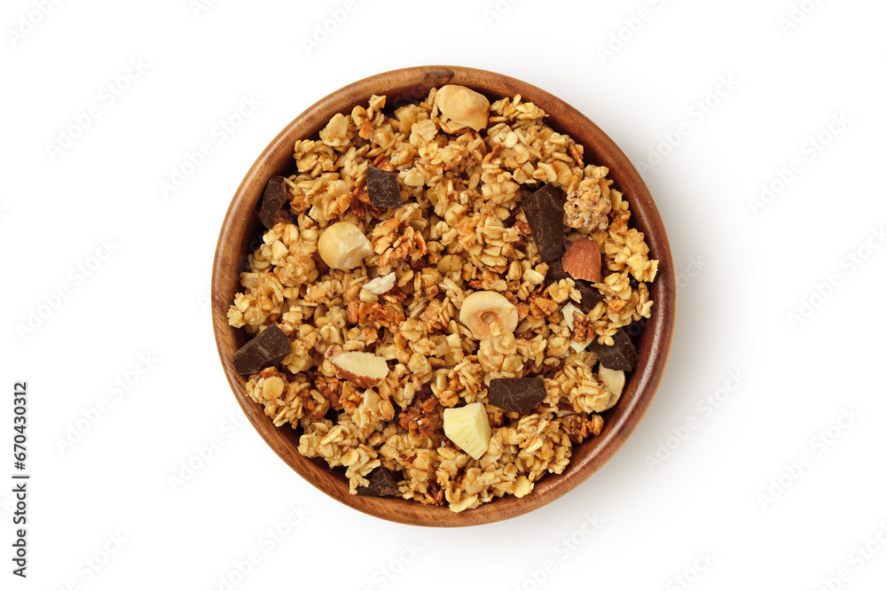 Homemade granola in wooden bowl on white background Homemade granola in wooden bowl on white background