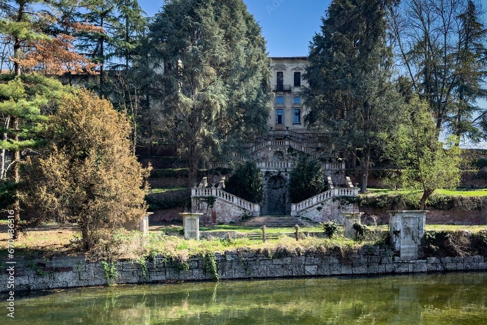 Picturesque view of an old, grand palace along the Naviglio Grande river in Lombardy, Italy Picturesque view of an old, grand palace along the Naviglio Grande river in Lombardy, Italy