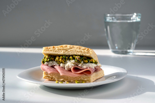 Mortadella sandwich with ricotta and pistachio pesto. Made with Focaccia - simple homemade bread.