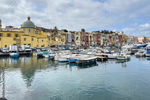 Idyllic marina scene of Procida Marina Grande port in Campania, Italy with fishing boats © Wirestock